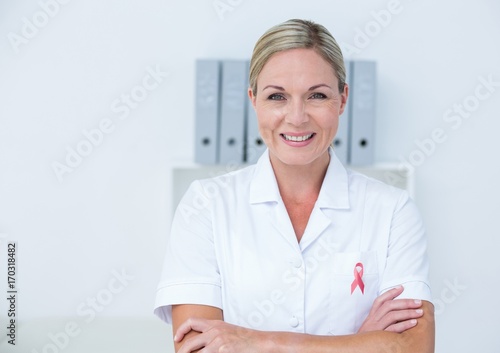 Doctor woman with breast cancer awareness ribbon