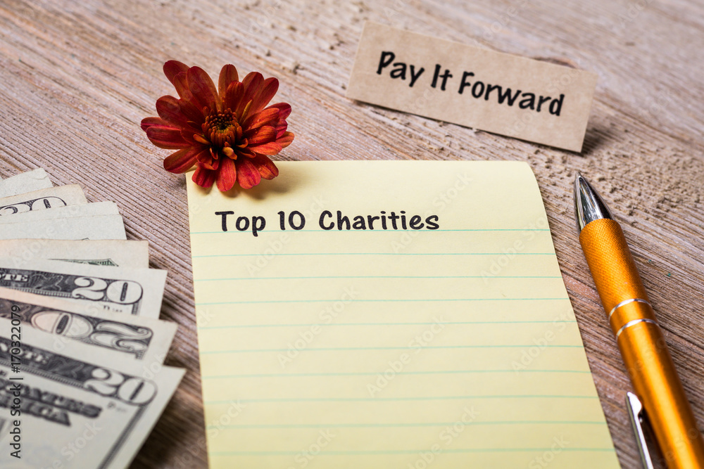 Top 10 Charities concept on notebook and wooden board Stock Photo | Adobe  Stock