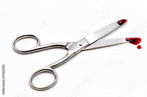 scissors with blood on a white background