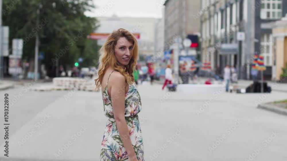 beautiful young blond woman walking around the city.slow motion beautiful young blond woman walking around the city.slow motion