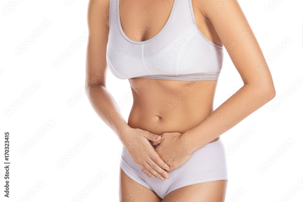 Woman is feeling pain in lower part of her stomach Woman is feeling pain in lower part of her stomach