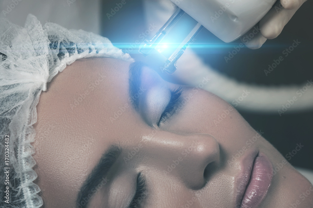 Fototapeta premium Beautiful woman in beauty salon during rejuvenation procedure