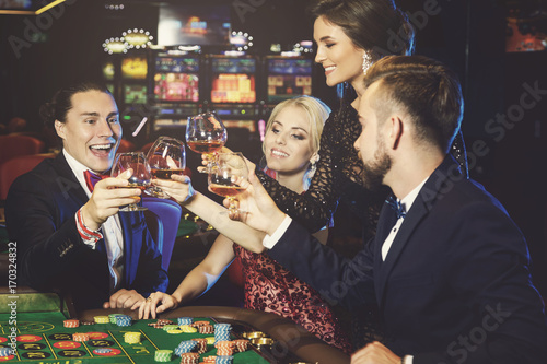 Photography People celebrating their win after successful game in the casino