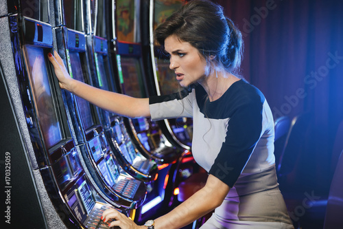 Woman is losing during slot machines game
