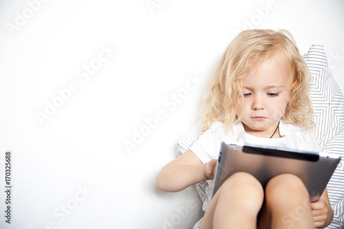 Child using tablet computer