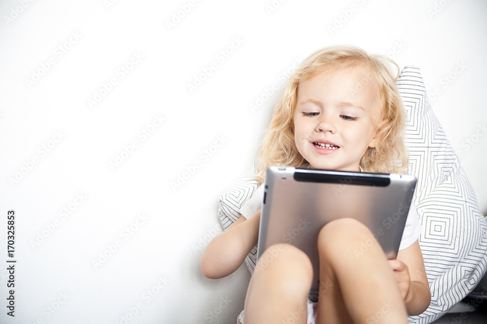 Child using tablet computer