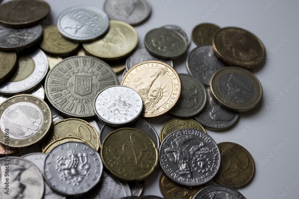 A beautiful image of different coins under natural light. Can be used as a greeting card A beautiful image of different coins under natural light. Can be used as a greeting card