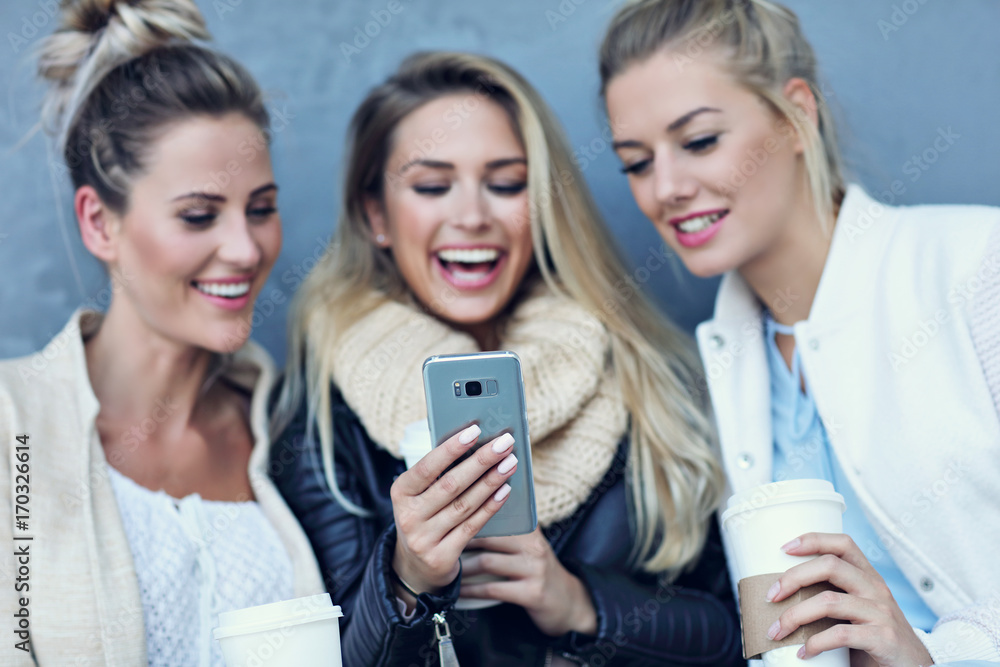 Happy group of friends taking selfie outside in autumn season Happy group of friends taking selfie outside in autumn season