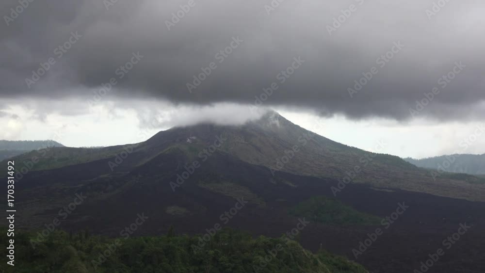 Fog and clouds over a volcano and an lake Gunung-Batur or Batur, Bali Indonesia Fog and clouds over a volcano and an lake Gunung-Batur or Batur, Bali Indonesia