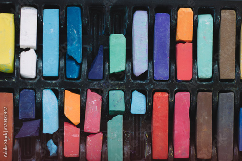 multicolored chalks in a box close up