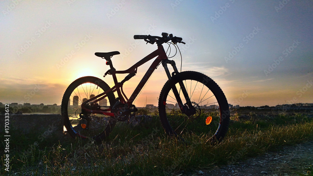 Mountain bike silhouette at sunset