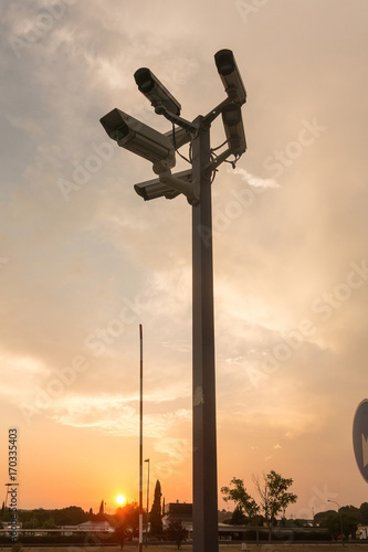 Six cctv security cameras on the street pylon. Security cameras mounting on the high top position
