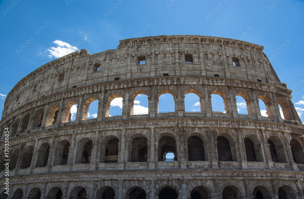 View of Colosseum in Rome with blue sky Italy, Europe.