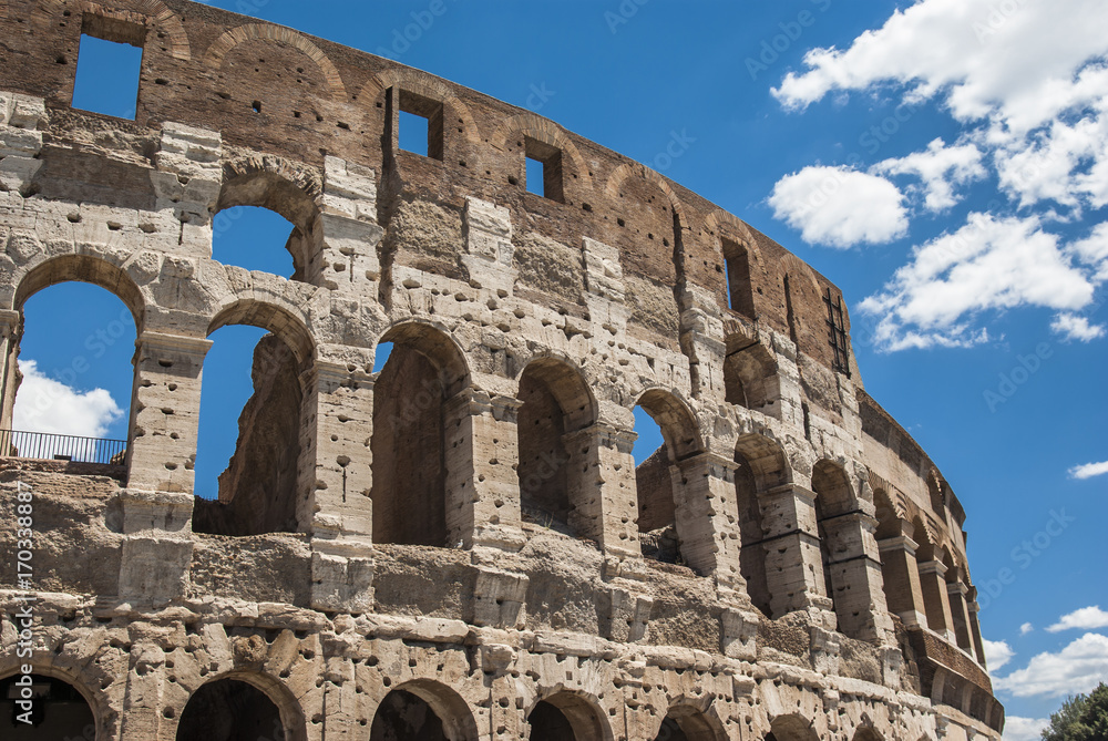 View of Colosseum in Rome with blue sky Italy, Europe. View of Colosseum in Rome with blue sky Italy, Europe.