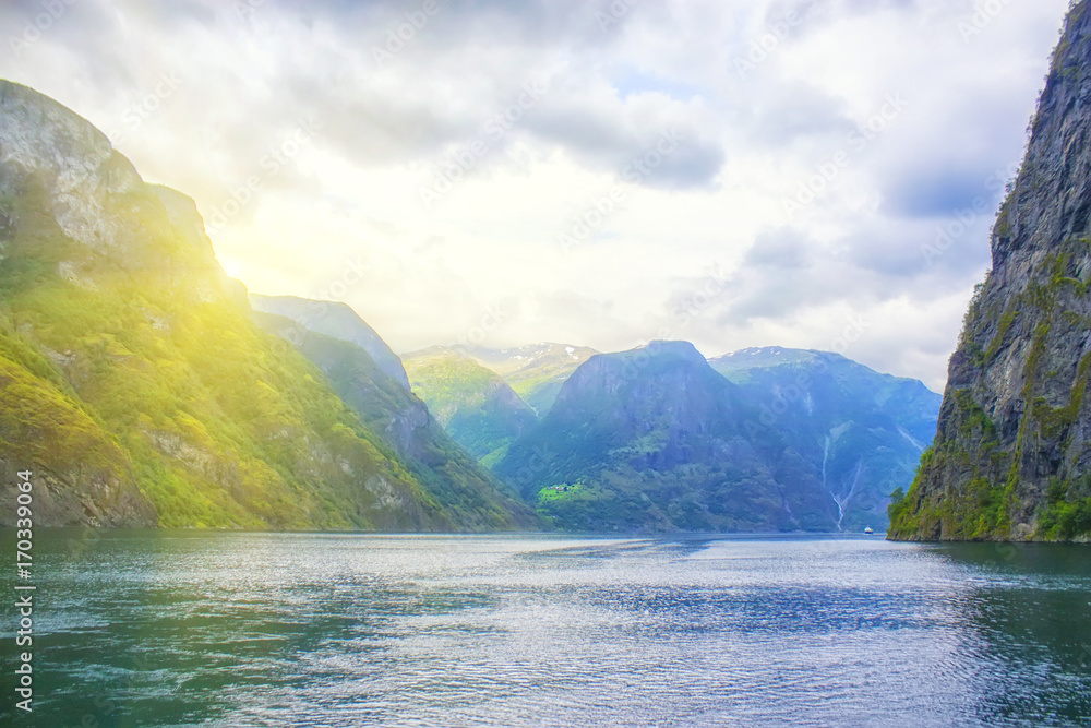 beautiful and dramatic Norway landscape with mountains and sea in fjord