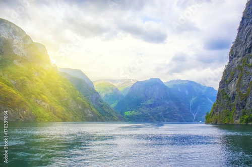 beautiful and dramatic Norway landscape with mountains and sea in fjord © sergeialyoshin