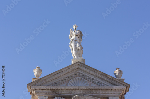Just Statue present above the tympanum of the military arsenal of Venice