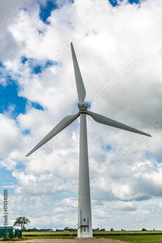 View of a large wind turbine from a wind farm