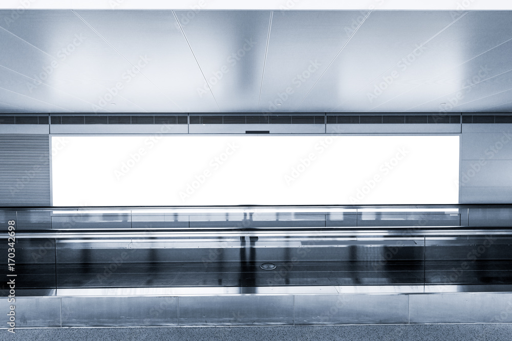 empty billboard and modern escalator at a international airport empty billboard and modern escalator at a international airport