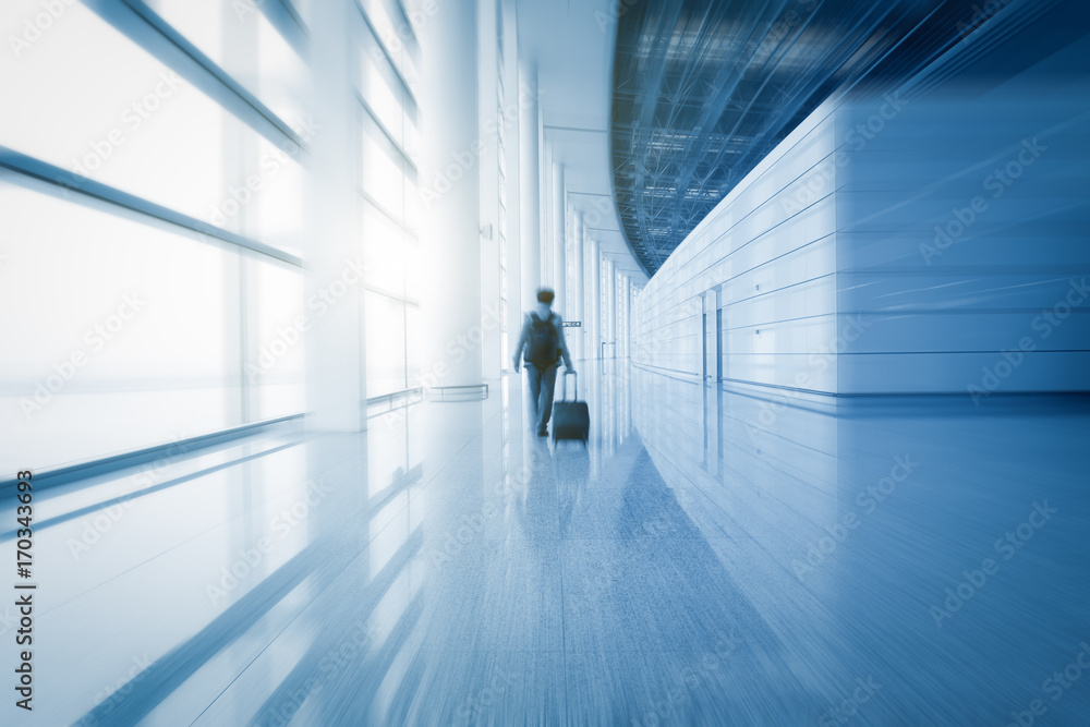 modern airport scene of passenger motion blur with window outside. modern airport scene of passenger motion blur with window outside.