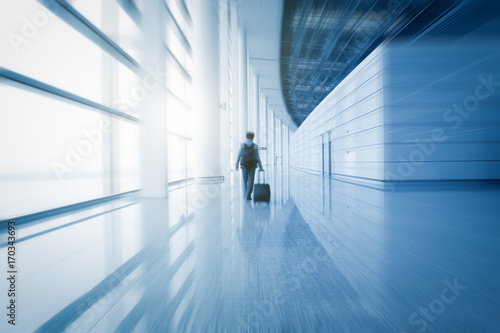 Photography modern airport scene of passenger motion blur with window outside