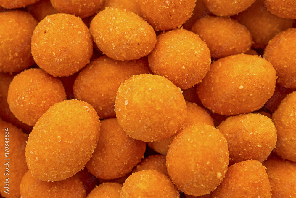 Crispy chilli peanuts snacks macro close up. Orange peanuts for background Crispy chilli peanuts snacks macro close up. Orange peanuts for background