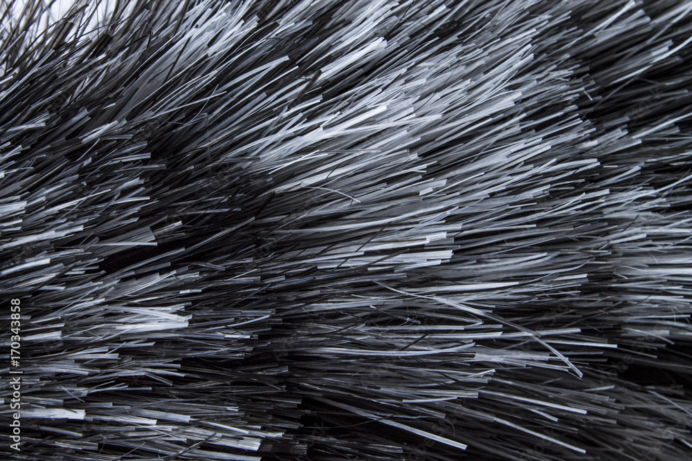 Obraz premium A closeup view of a bunch of shiny straight grey hair in a wavy curved style