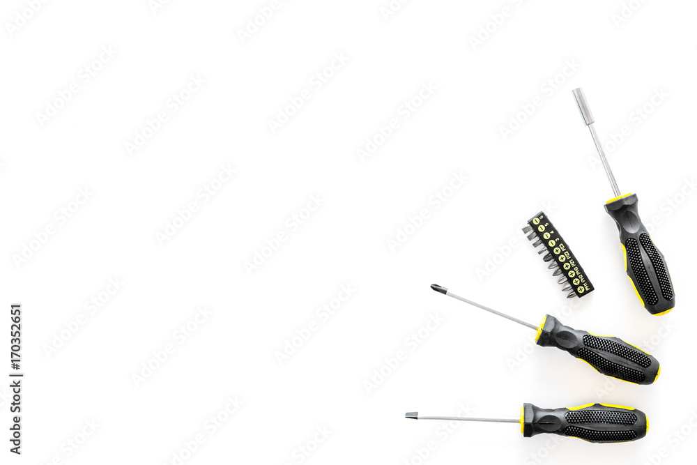 constructor desk with set of building implements with screwdriver white desk background top view mock up constructor desk with set of building implements with screwdriver white desk background top view mock up
