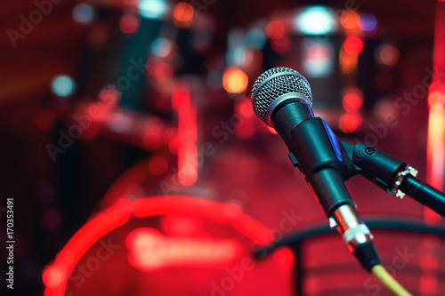 Microphone at concert on the stage with colorful light