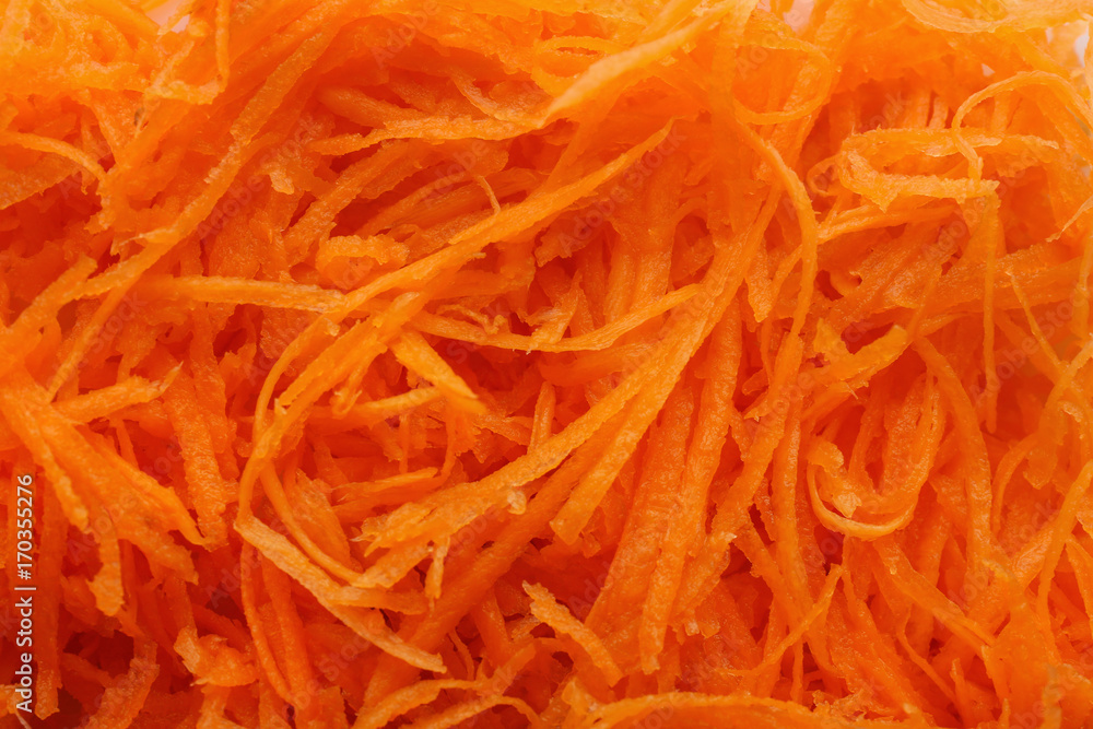 Fresh grated carrot, closeup