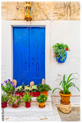 Charming rustic floral decoration of streets in Greek islands