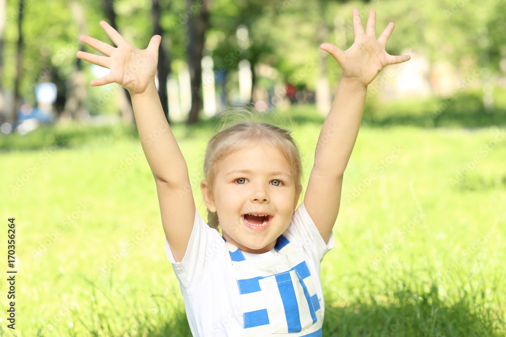 Cute little girl in park on sunny day Cute little girl in park on sunny day