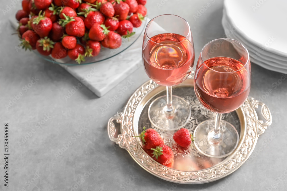 Glasses of strawberry wine on golden tray Glasses of strawberry wine on golden tray