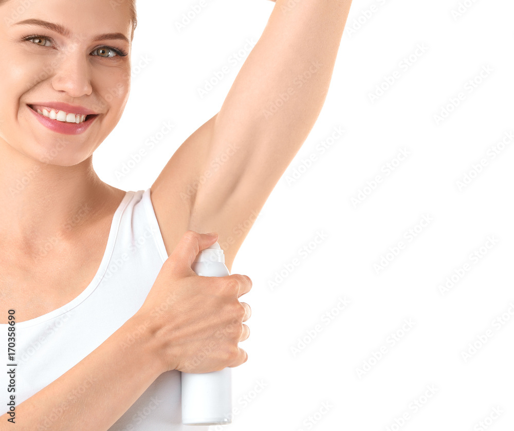 Beautiful young woman with deodorant on white background Beautiful young woman with deodorant on white background