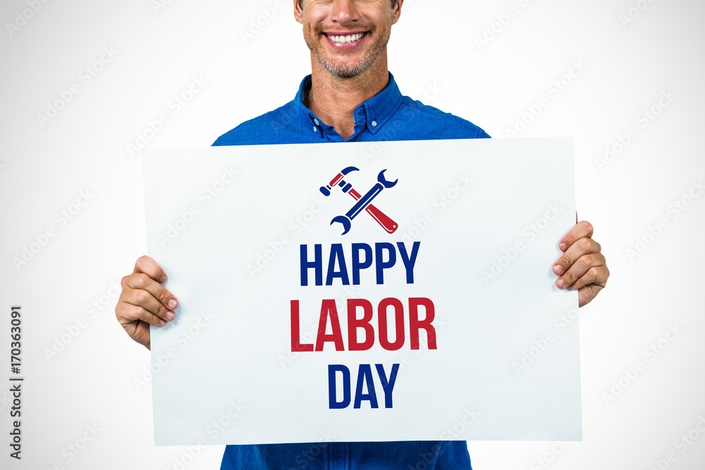Composite image of portrait of happy man holding placard Composite image of portrait of happy man holding placard