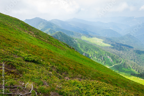 Travel, trekking, nature. Majestic, high green mountains. Horizontal frame