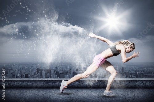 Composite image of sporty woman running on a white background