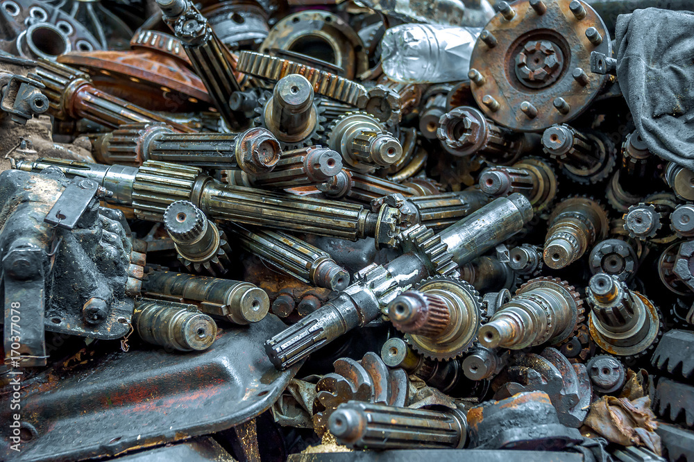 Metal scrapyard. Engine parts. Used metal gears. Used engine parts. Metal scrapyard. Engine parts. Used metal gears. Used engine parts.