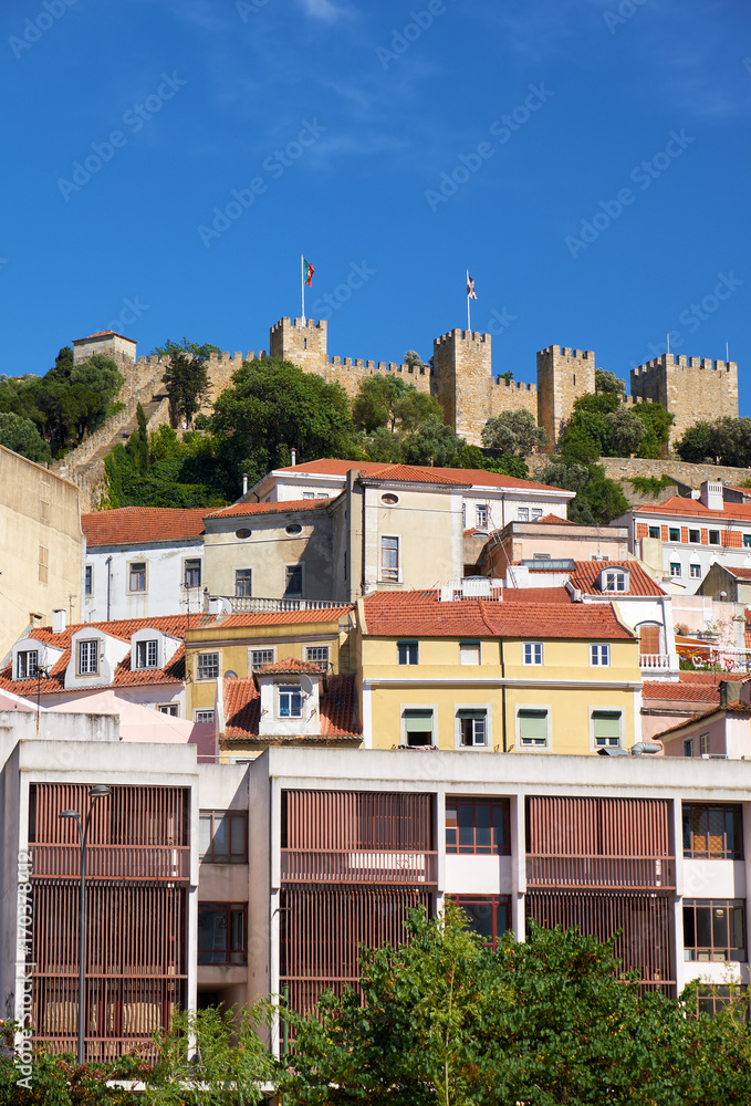 Saint George Castle surrounded by residential houses of Alfama. Lisbon. Portugal