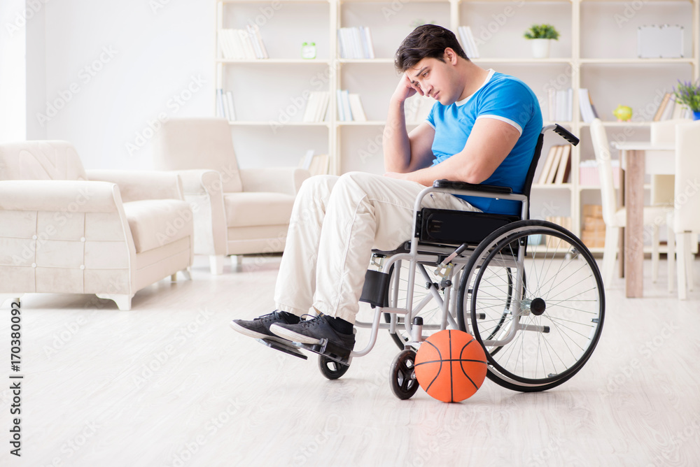 Young basketball player on wheelchair recovering from injury Young basketball player on wheelchair recovering from injury