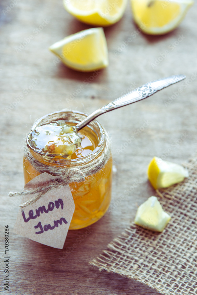 Homemade lemon jam in glass jar. Organic fresh yellow jam Homemade lemon jam in glass jar. Organic fresh yellow jam