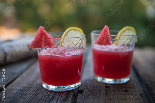 Watermelon coctail on a wooden board in a garden. Selective focus