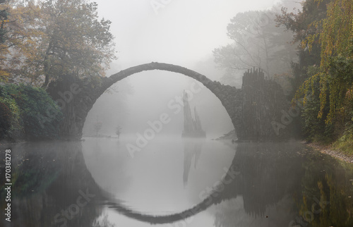 Devil's bridge in Kromlau in autumn coat