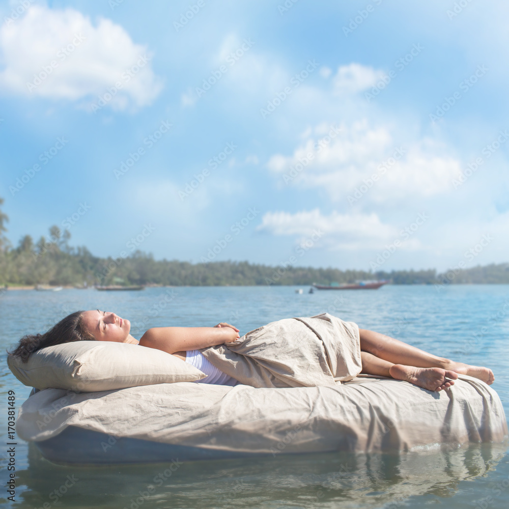 Sleeping woman lies on airbed Sleeping woman lies on airbed