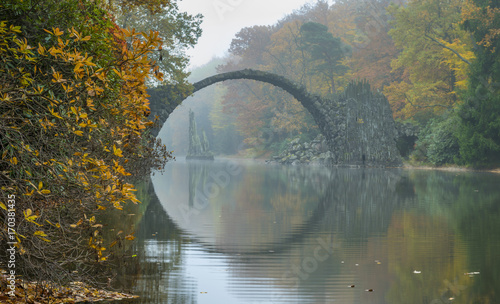 Devil's bridge in Kromlau in autumn coat