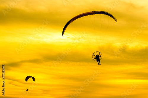 sunset sky background with paramotor