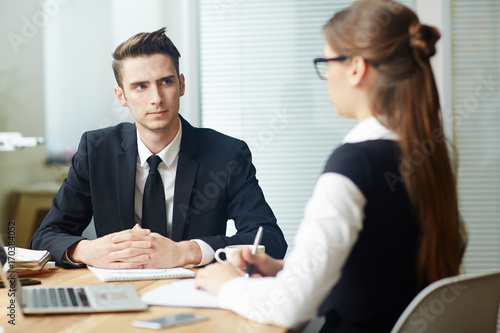 Wallpaper Mural Young applicant listening to employer question during interview Torontodigital.ca