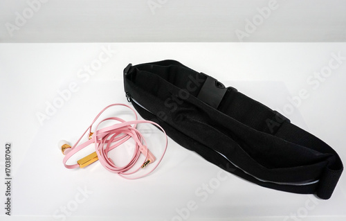 mobile phone waist pocket with cute pink earphone for music listening during running