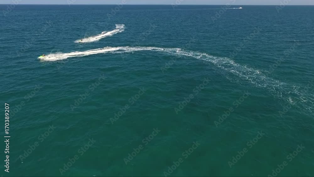 Aerial view jetskis in ocean