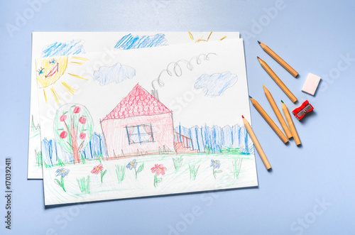 Children's drawing and color pencils top view